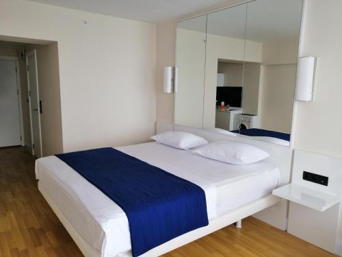 Postel nebo postele na pokoji v ubytování ORBi CITY TOWERS