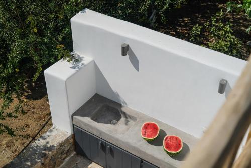 two slices of watermelon sitting on top of a machine at Ikies of Mykonos in Mýkonos City
