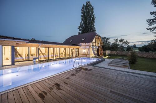 a house with a swimming pool in front of a house at Jordan's Untermühle in Köngernheim