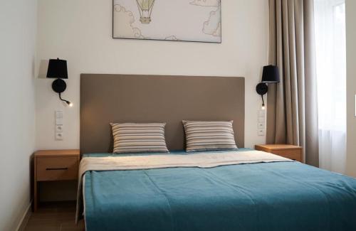 Postel nebo postele na pokoji v ubytování Onyx Family