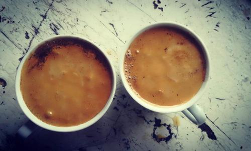 two cups of coffee sitting on a table at wine valley in Udabno