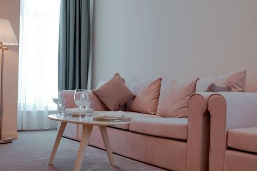 a living room with a couch and a table at Khazar Inji in Baku