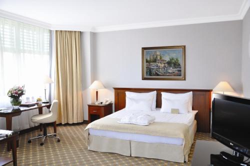 Postel nebo postele na pokoji v ubytování Hotel Midi