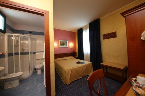 Ліжко або ліжка в номері Hotel Abacus