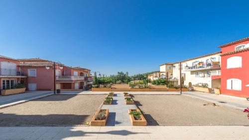 an empty street in a city with buildings at Vacancéole – Le Domaine de Camiole in Callian