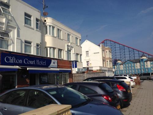 a row of cars parked in a parking lot at Clifton Court Hotel in Blackpool