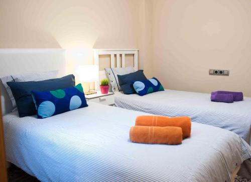 Un pat sau paturi într-o cameră la Alcam Barbera Terrazas