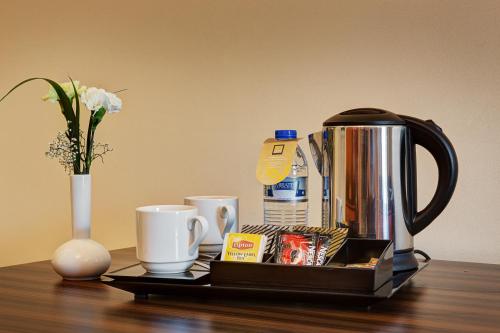  Abidos Hotel Apartment Dubai Land -  Room  picture :   Tea/Coffee maker    Bath    Safety deposit box                           