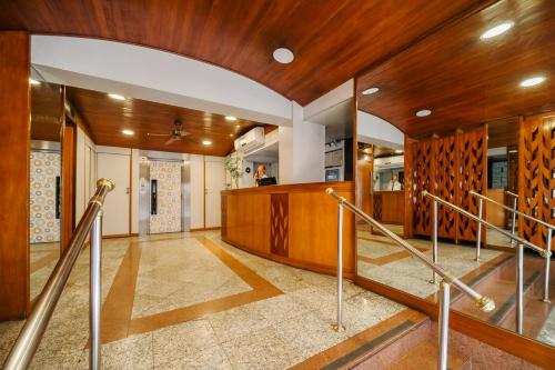 a hallway with wood paneling and stairs in a house at Infinity Copacabana in Rio de Janeiro