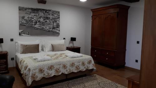 Ένα ή περισσότερα κρεβάτια σε δωμάτιο στο Quinta do Bravio