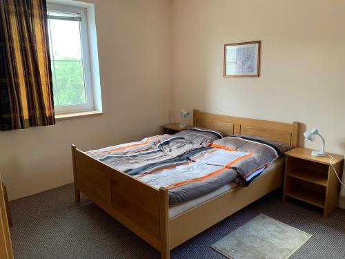 Кровать или кровати в номере Villa Frymburk
