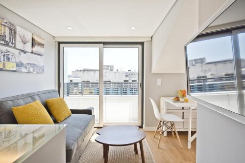 a living room with a couch and a table at BmyGuest Bruno’s 36 Apartments in Lisbon