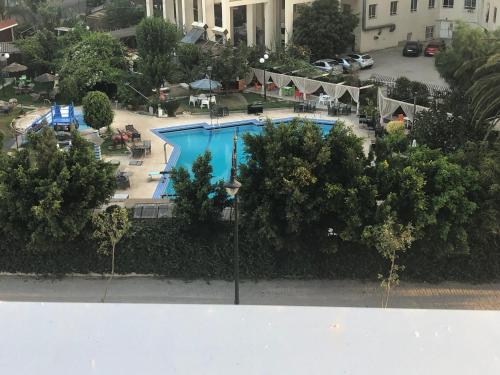 - une vue sur la piscine d'une ville dans l'établissement Haut standing beach apartment, à Tanger