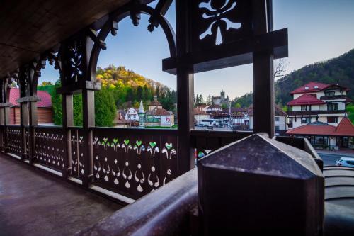 a view of a town from a gazebo at Hanul Bran in Bran