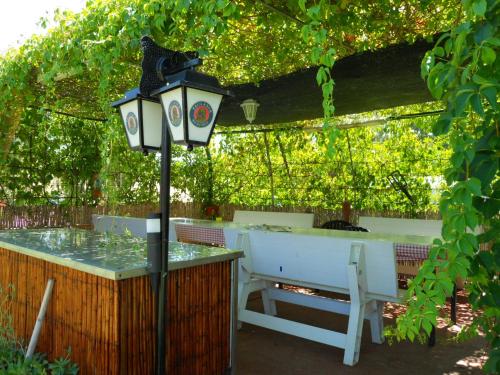 a table and a street light next to a table and a table and a table at Agriturismo Monte Majore in Siliqua