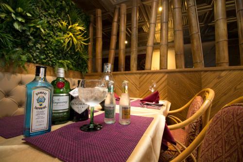 a table with bottles of alcohol and a wine glass at Highfield Hotel in Houghton le Spring