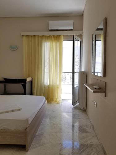 Postel nebo postele na pokoji v ubytování Galini Apartment