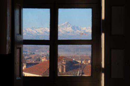 a view from a window of a mountain view at Villa Rambaudi in Sanfrè