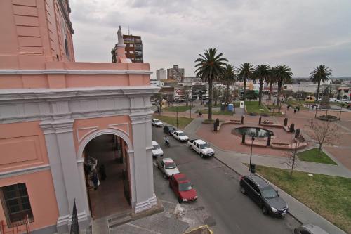 a view of a city with cars parked on the street at De la Plaza Hotel in Maldonado