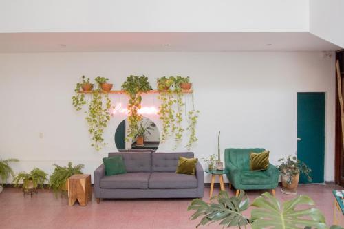 a living room with a couch and two chairs at Casa Sabina in Guadalajara