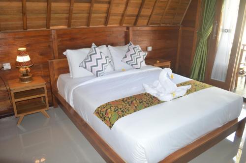 En eller flere senger på et rom på Nyuh Gading Bungalow Nusa Penida