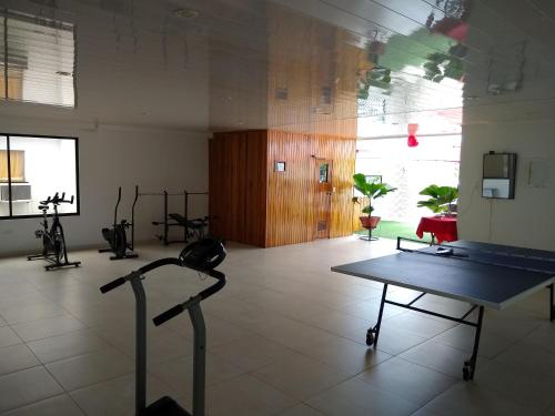 a room with a table in the middle of a room at Hotel Nova Park in Arauca