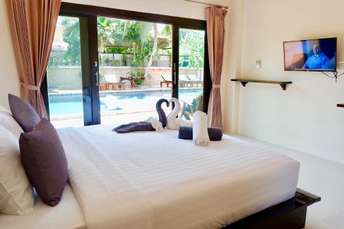 Postelja oz. postelje v sobi nastanitve Aiya Resort Koh-Tao