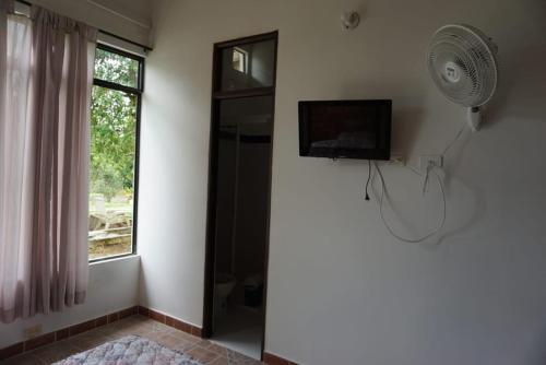 TV a/nebo společenská místnost v ubytování Hostal Suna Vito