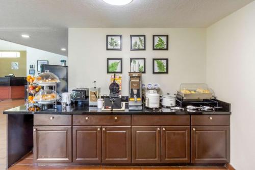 a kitchen with a counter with food on it at Sleep Inn Ogden near Event Center in Ogden