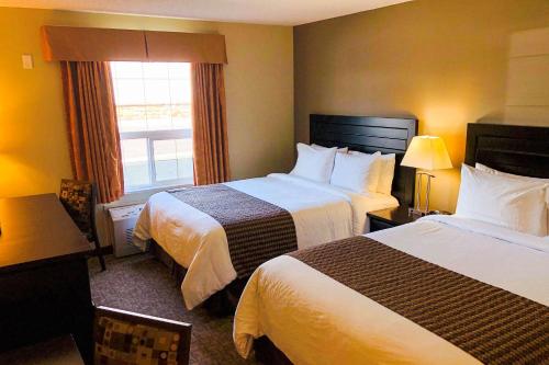 Katil atau katil-katil dalam bilik di Econo Lodge