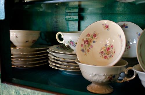 a shelf filled with plates and cups and bowls at Luma Casa De Montaña in Villa La Angostura