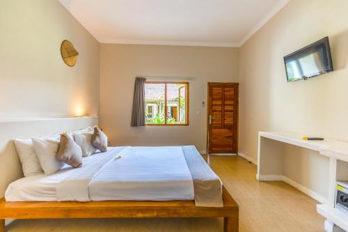 Katil atau katil-katil dalam bilik di Nativo Lombok Hotel