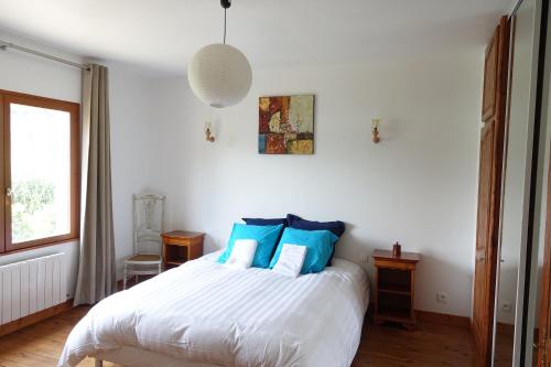 Postel nebo postele na pokoji v ubytování Maison du Buis doré