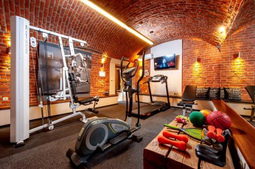a room with a gym with weights and exercise equipment at Amber Boutique Hotels - Hotel Amber in Krakow