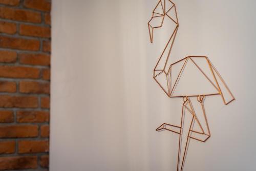 a group of origami objects hanging on a wall at Lu Apartments in Oświęcim