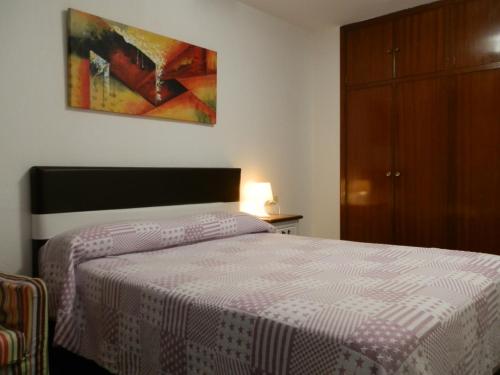 Postel nebo postele na pokoji v ubytování Apartamentos Turisticos Beatriz