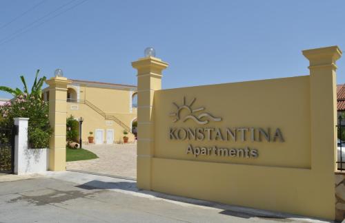 a sign on the side of a building at Konstantina Apartments in Kavos