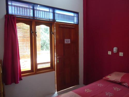 Postel nebo postele na pokoji v ubytování Kancil homestay