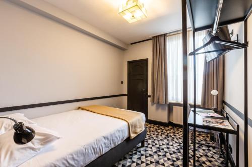 Postel nebo postele na pokoji v ubytování Hotel des Colonies Brussels by Mercure