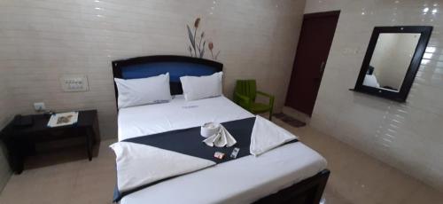 Кровать или кровати в номере Hotel Prakash