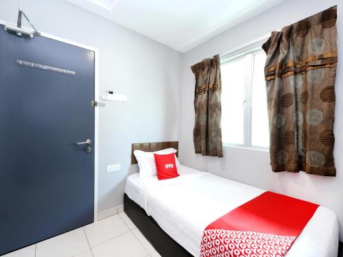 Ένα ή περισσότερα κρεβάτια σε δωμάτιο στο Super OYO 1184 Ho Hotel