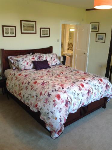 Ένα ή περισσότερα κρεβάτια σε δωμάτιο στο Baron's Grange