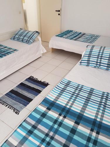 Postel nebo postele na pokoji v ubytování WB Apartment Flogita