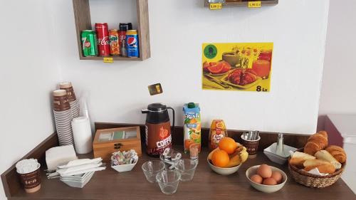 a counter top with a bunch of food on it at House bedroom in Burgas City
