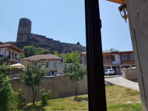 a view from a window of a town with a castle at kessane in Akhaltsikhe