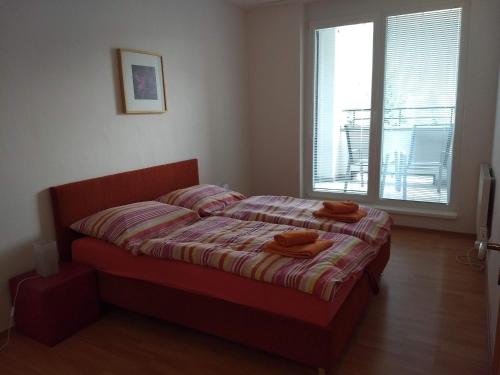 Una cama o camas en una habitación de Apartmán na Donovaloch