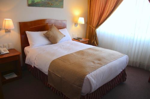 เตียงในห้องที่ Casona Plaza Hotel Arequipa