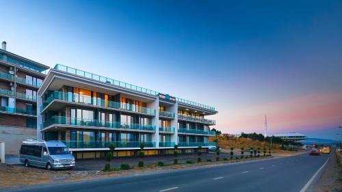 a van parked in front of a building at Lisi Hills Hotel in Tbilisi City