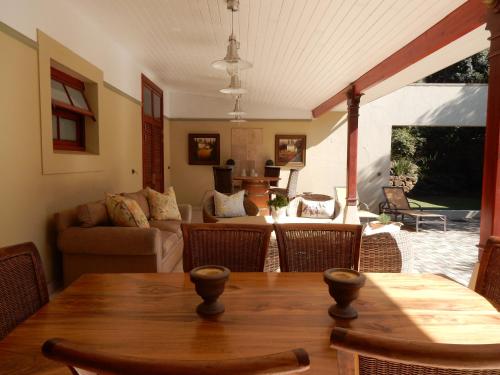 a living room with a table and a couch at The Courtyard at La Loggia in Nottingham Road