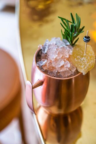 a copper cup filled with ice and a plant at 9Confidentiel in Paris